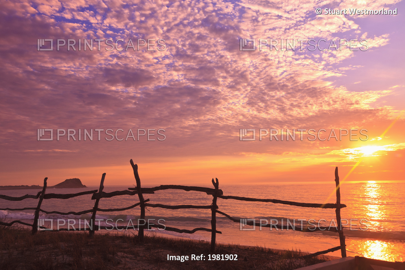 A Fence Along The Water's Edge At Sunrise At Cabo Pulmo; Baja California Sur, ...