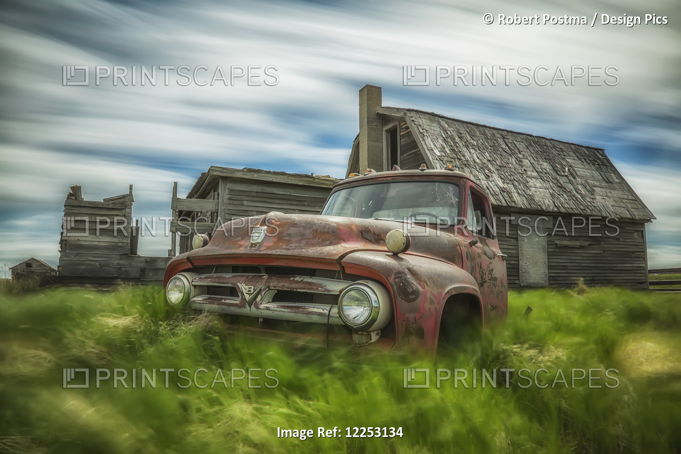Long Exposure Of Clouds Drifting By Over An Abandoned Truck And House In A ...