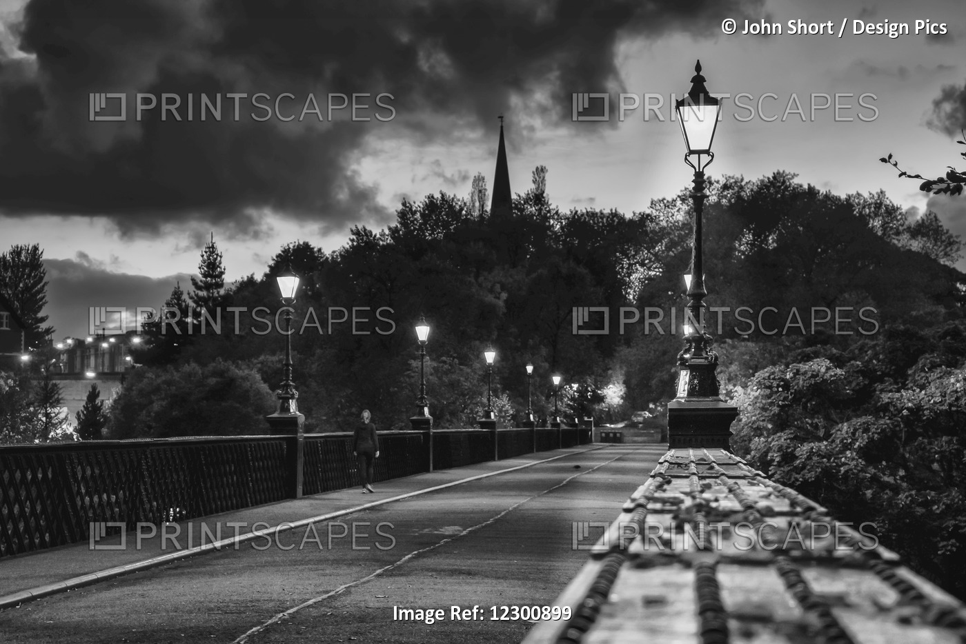 Illuminated Lamp Posts And Fence Along A Train Track; Newcastle, Tyne And Wear, ...