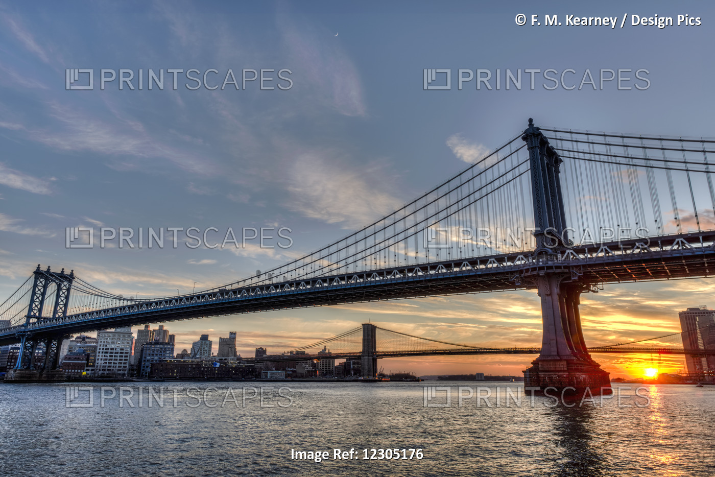 Sun Setting Behind Manhattan And Brooklyn Bridges; New York City, New York, ...