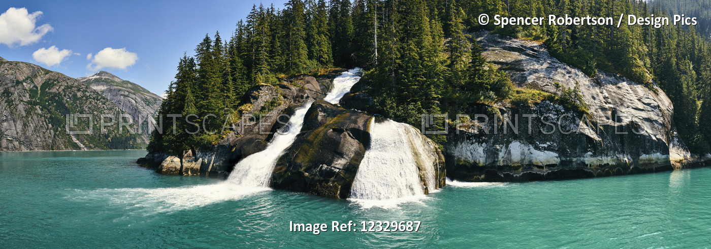 Waterfalls Over A Cliff Into The Water Along The Coastline In A Fjord; Alaska, ...