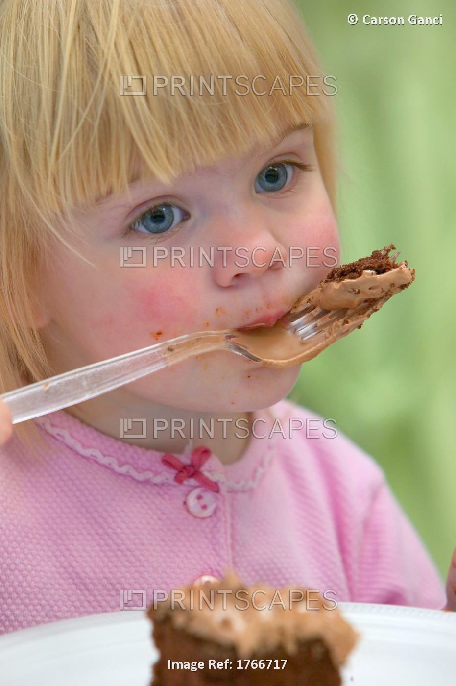Little Girl Eating Birthday Cake