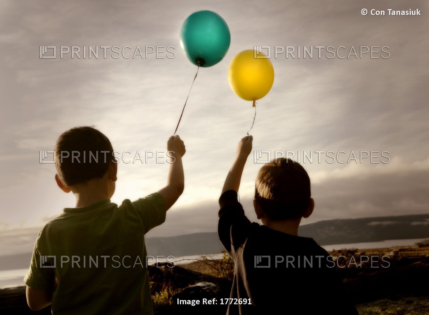Two Children With Balloons