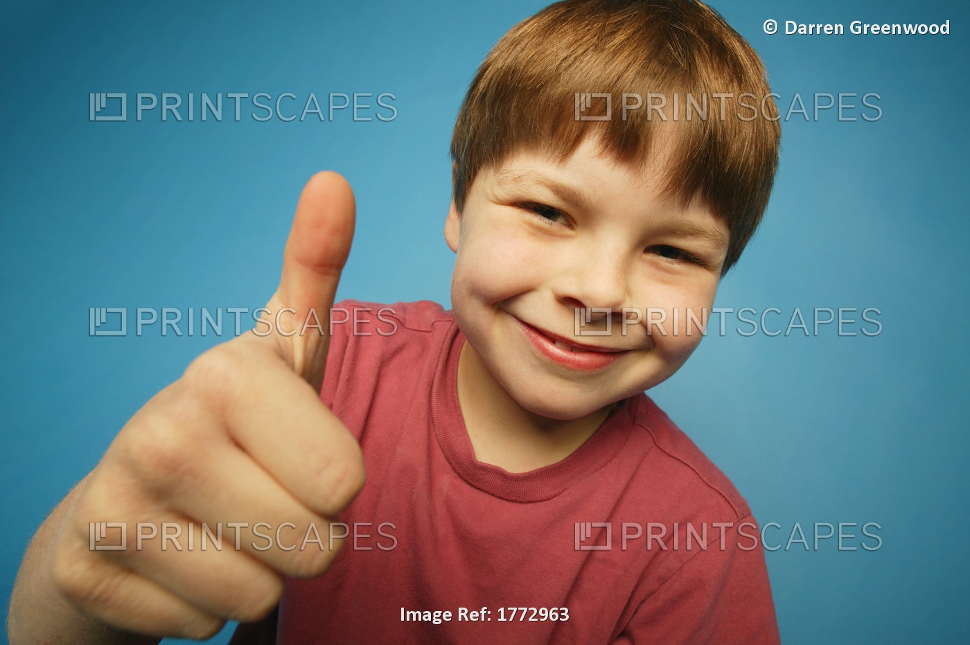 Boy Giving The Thumbs Up Sign