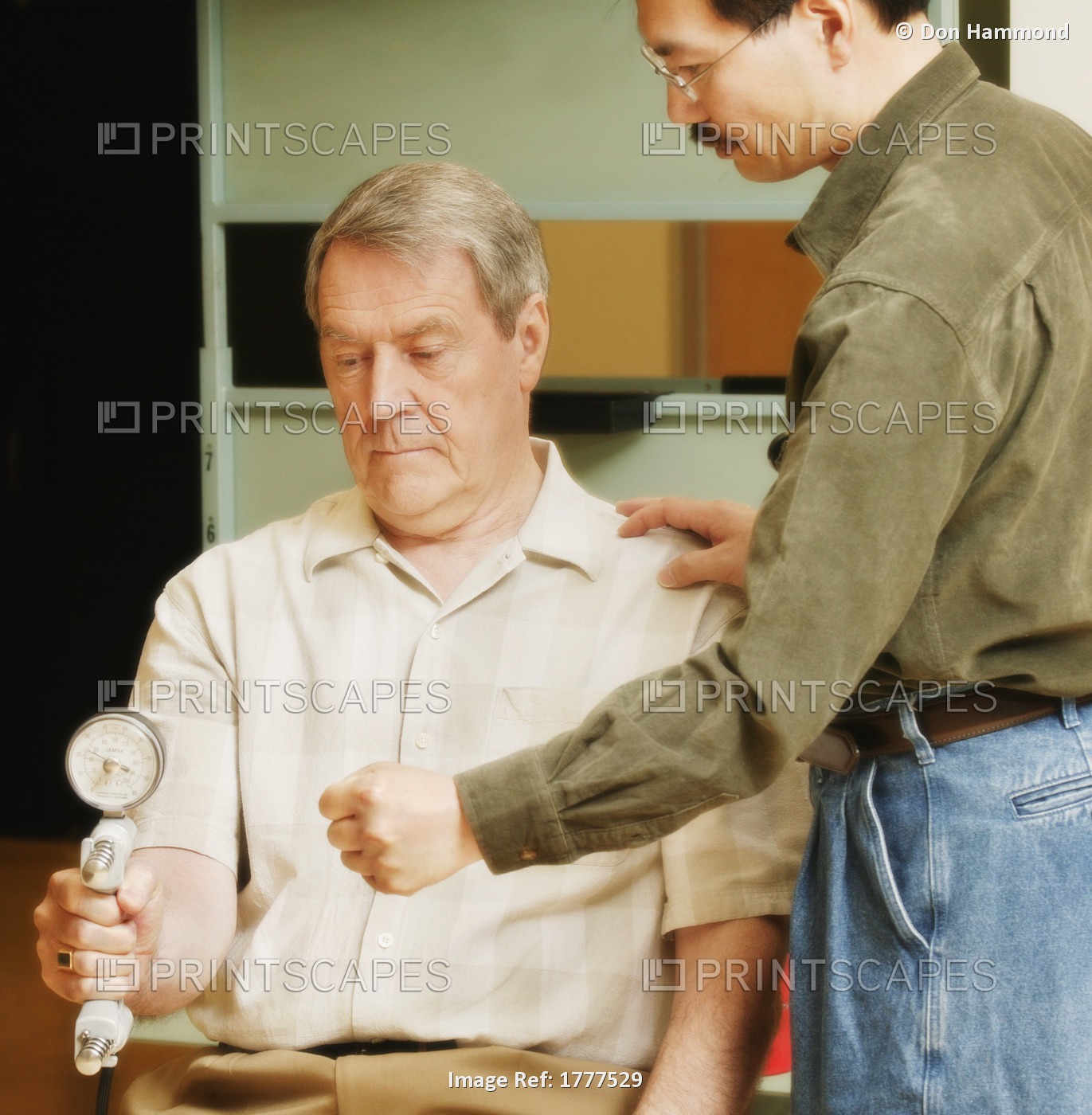 An Occupational Therapist Working With A Senior Businessman