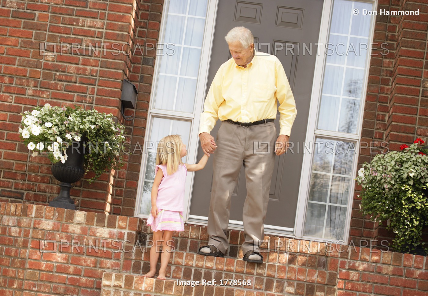 Child Holds Senior's Hand