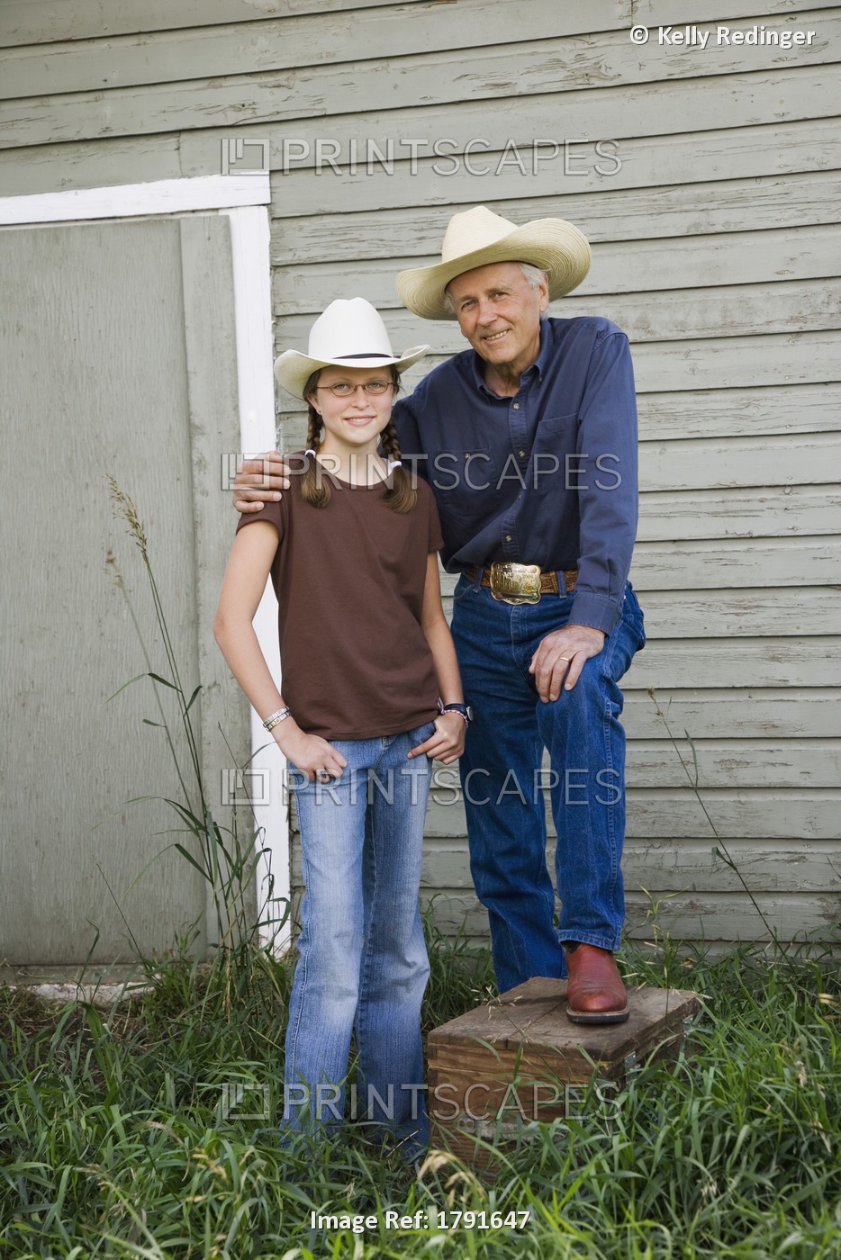 Grandfather And Granddaughter Wearing Cowboy Hats