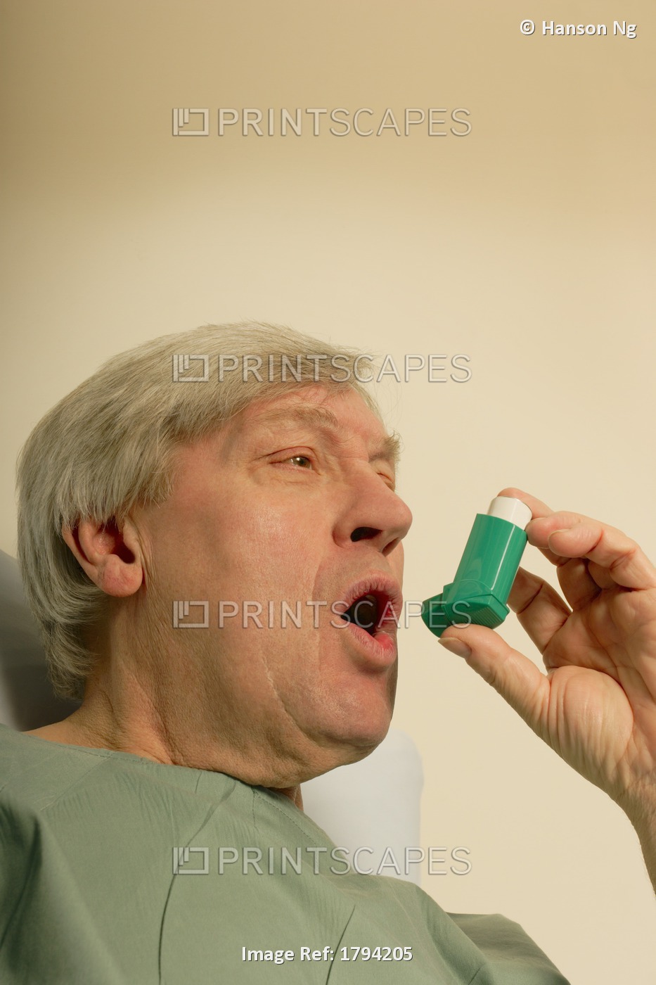 Man Holding An Inhaler