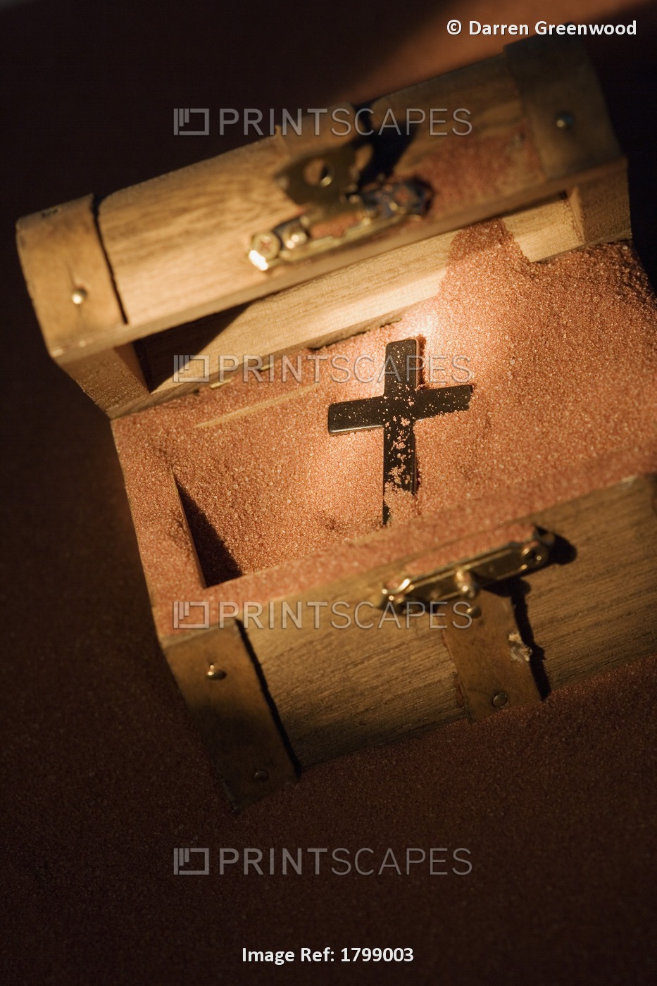 A Cross In A Wooden Box