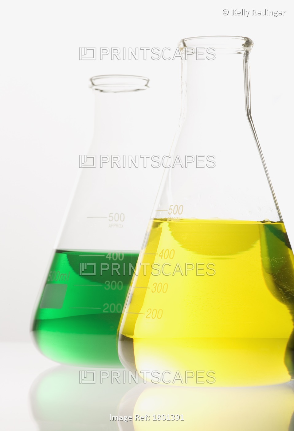 Two Glass Flasks With Colored Solutions