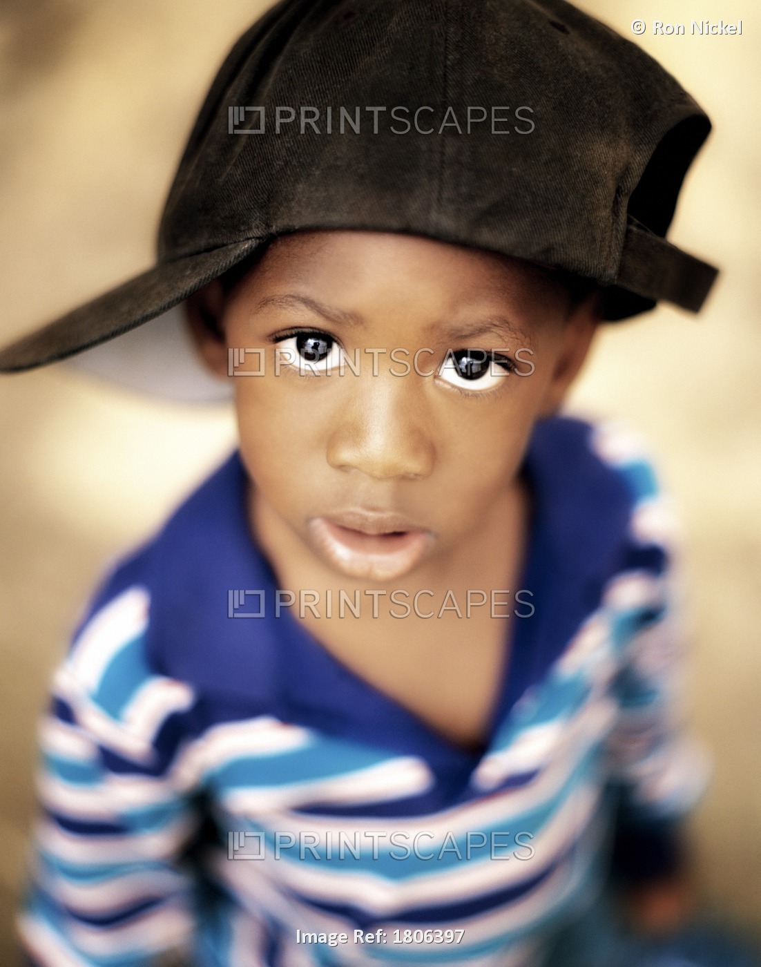 Boy Wearing Over Sized Hat Sideways