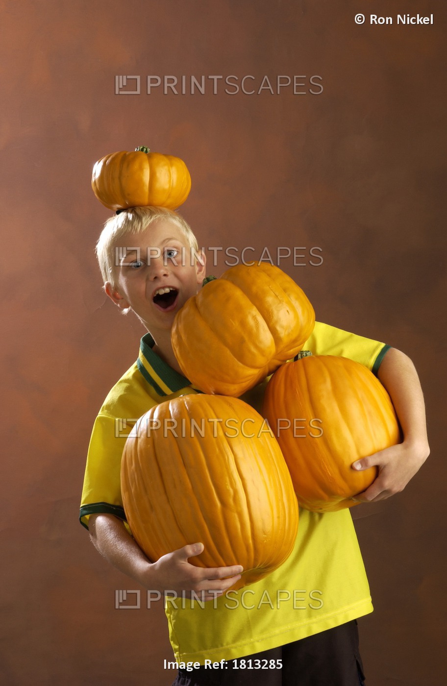 Boy Playing With Pumpkins