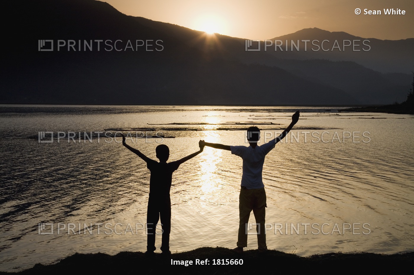 Children Holding Hands Stretched Up To The Sky