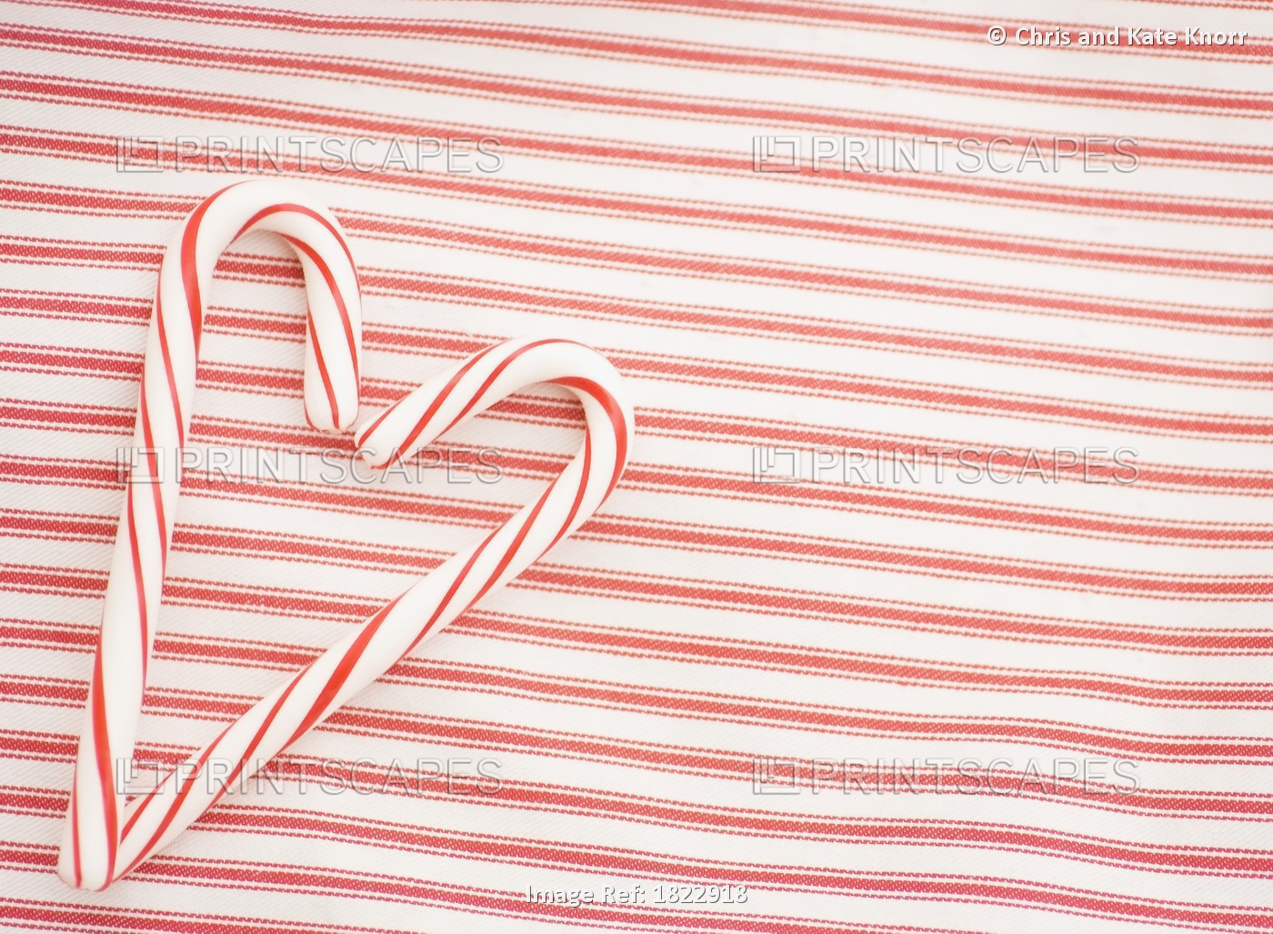 Two Candy Canes Making A Heart Shape