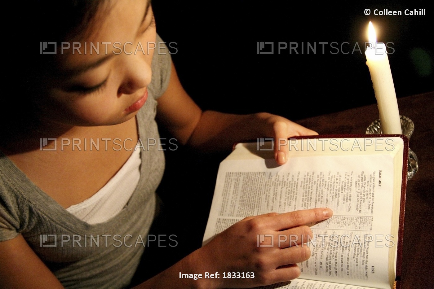 Girl Reading The Bible By Candlelight