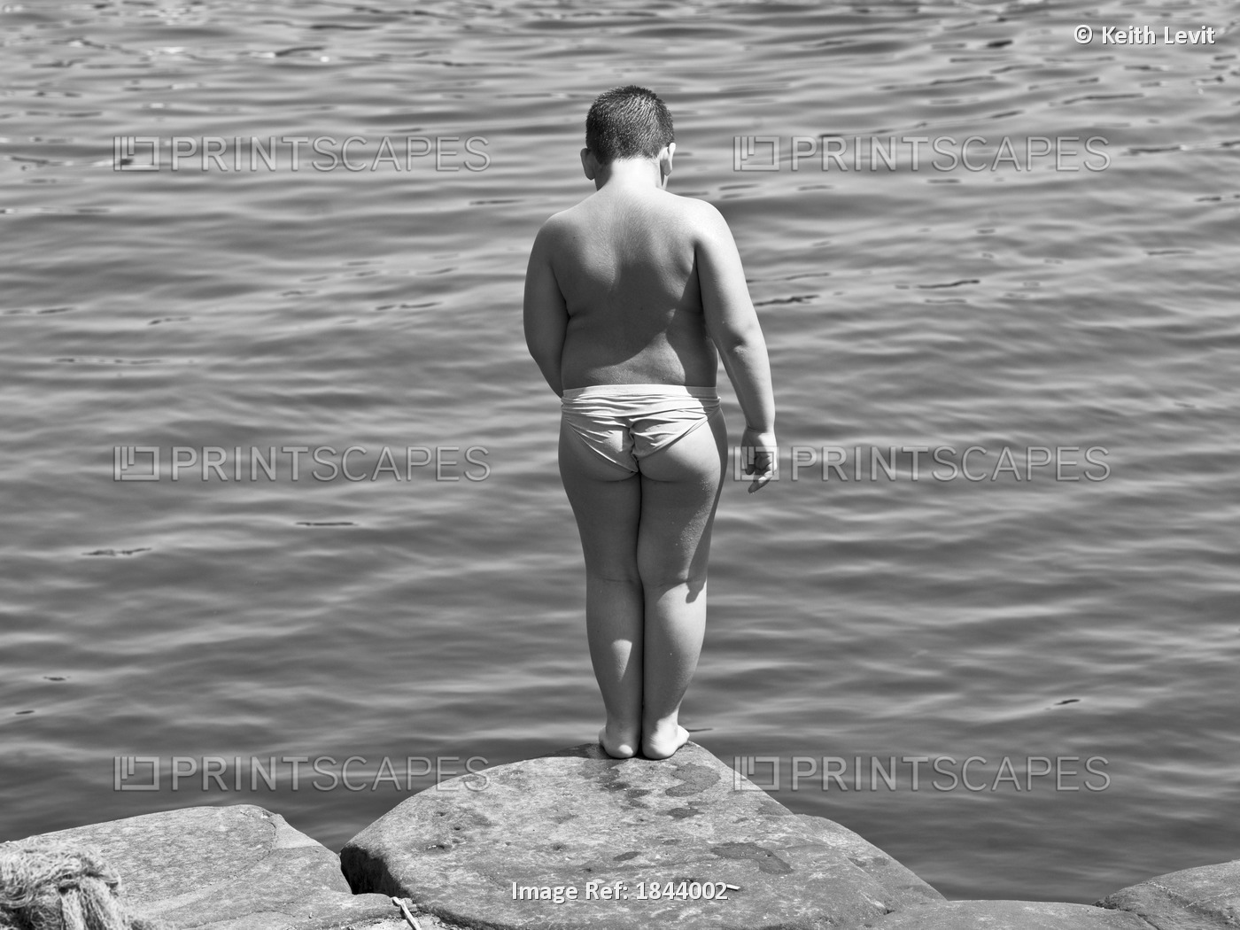 Naples,Italy,Young Boy Standing At Edge Of River