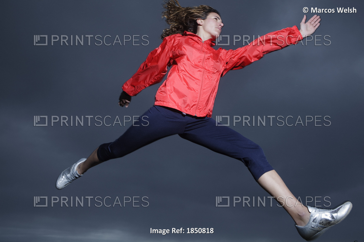 Athletic Woman Leaping In Mid-Air