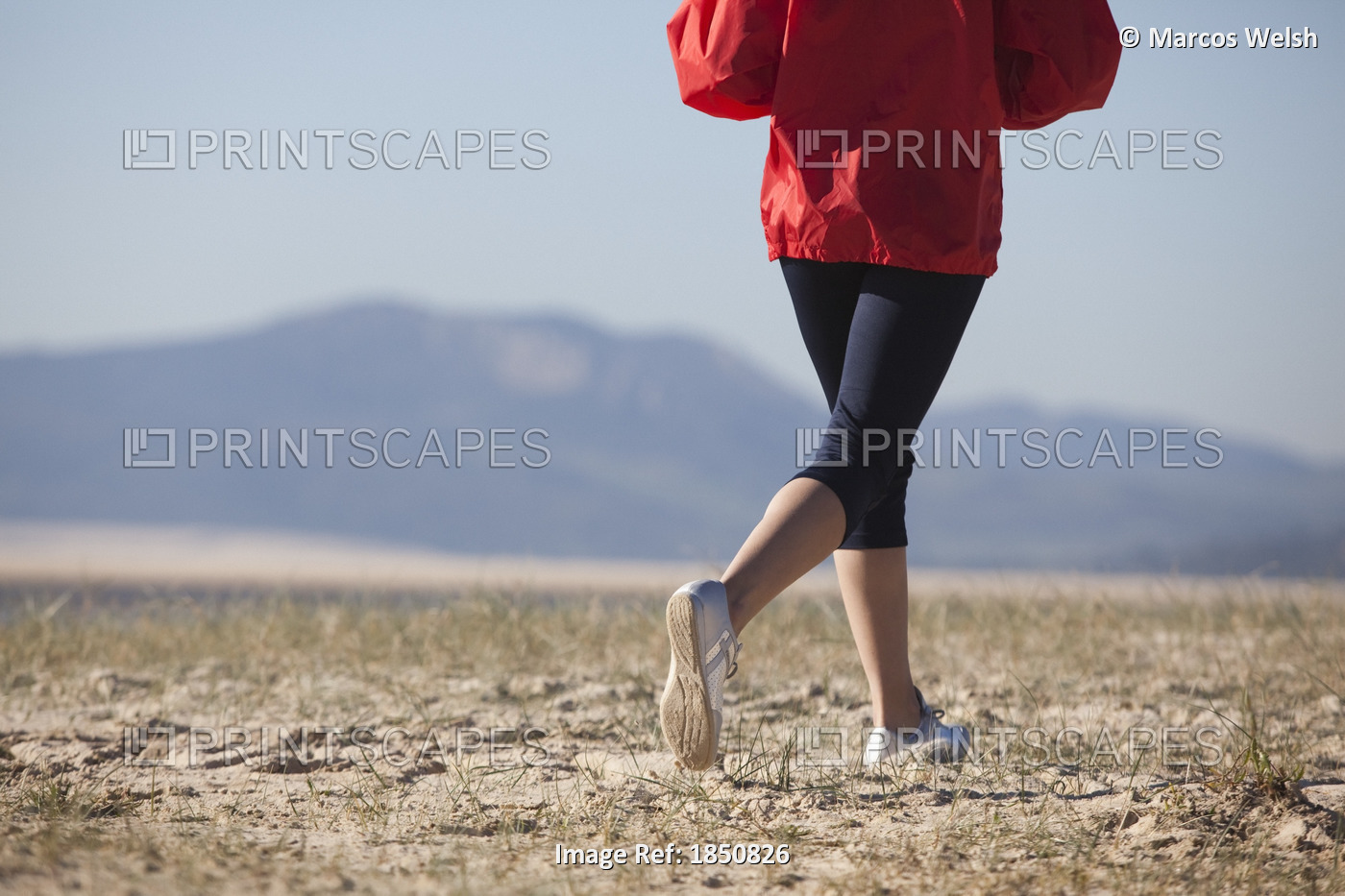 Athletic Woman Running On Beach