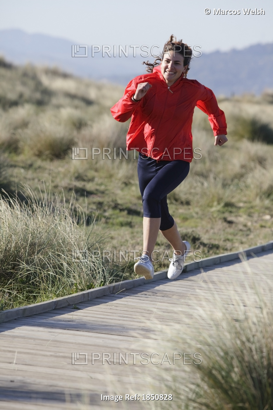 Athletic Woman Running On Boardwalk