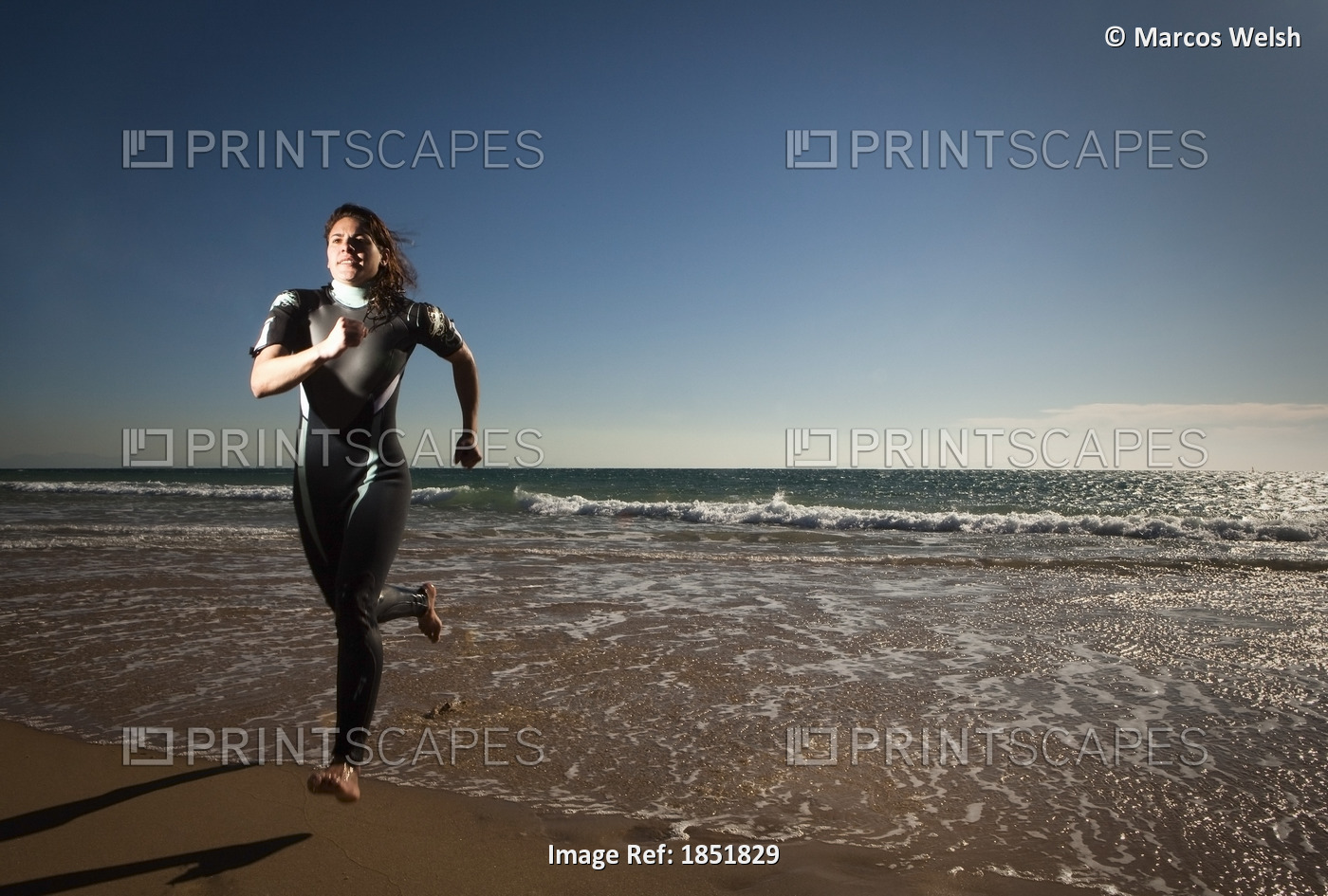 Woman Running On Beach