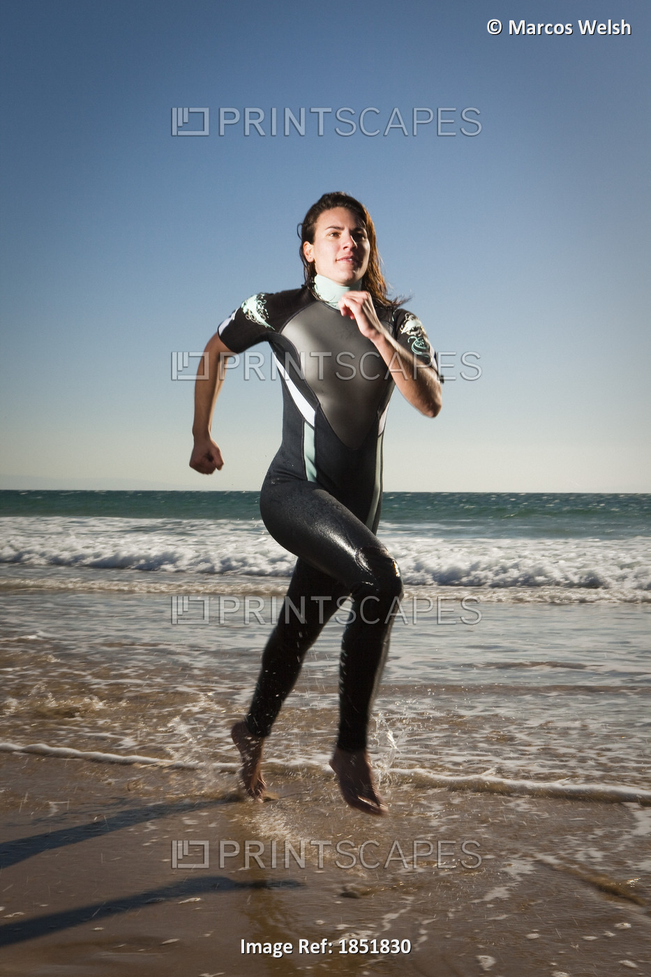 Woman Running On Beach