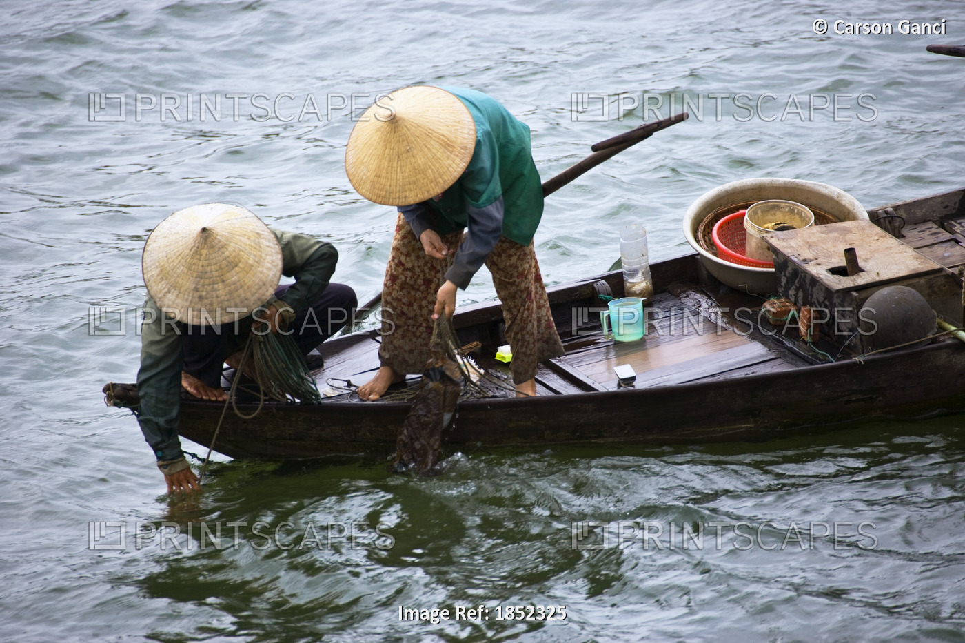 Women Fishing On A Small Boat In Vietnam; Hoi An,Vietnam
