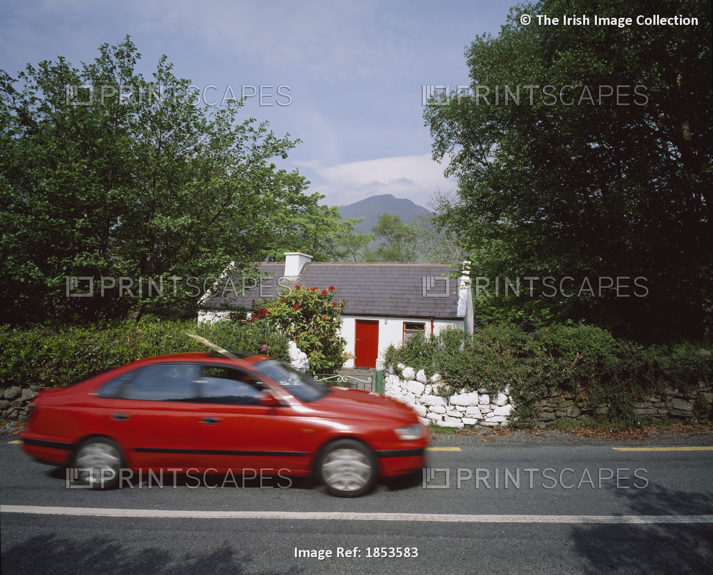 Car Driving Past Cottage, Leenane, County Galway, Ireland