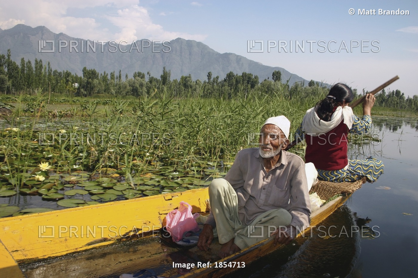 Man And Woman In A Boat; Dal Lake, Srinagar, Kashmir, India