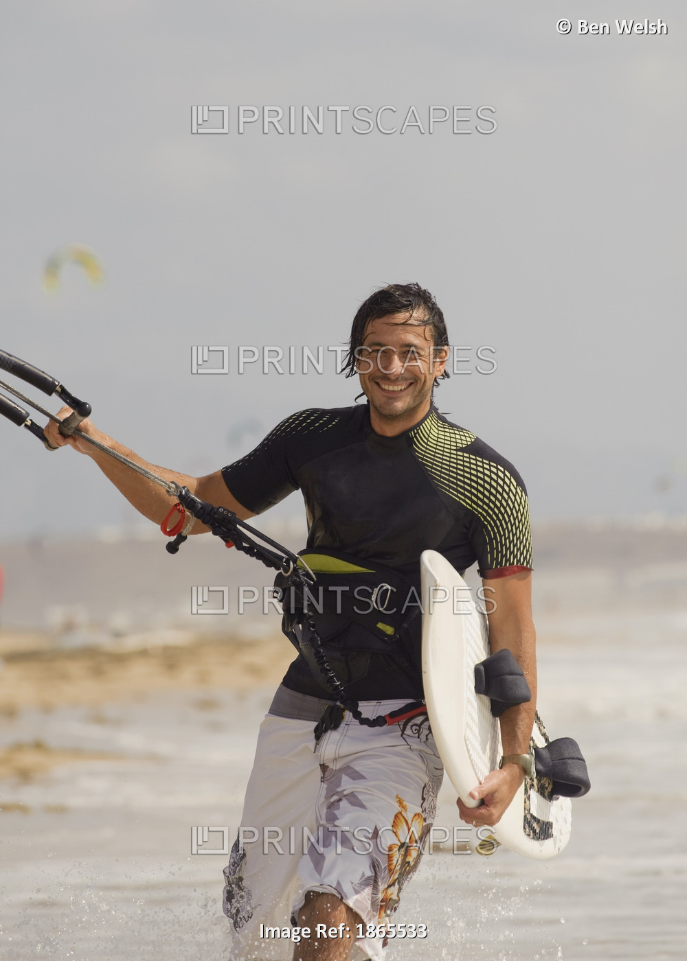 Man Carrying Kitesurfing Board