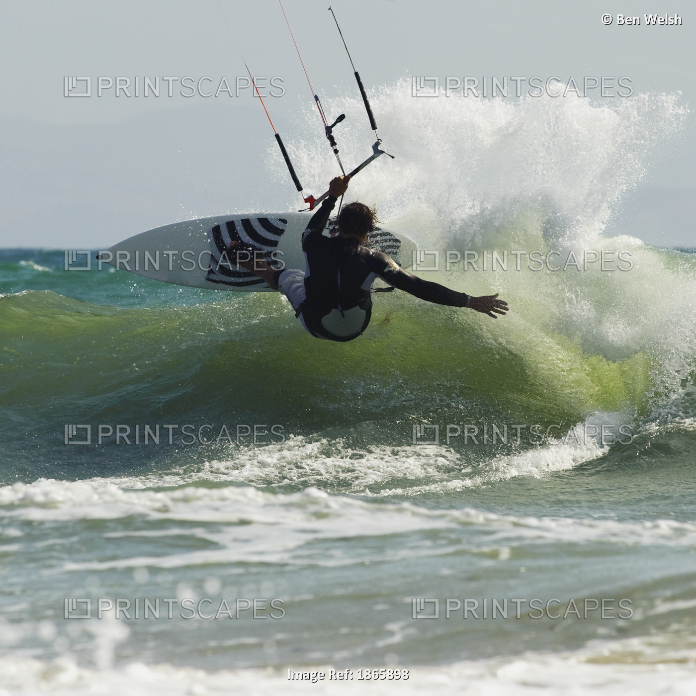Kitesurfer Catching A Wave