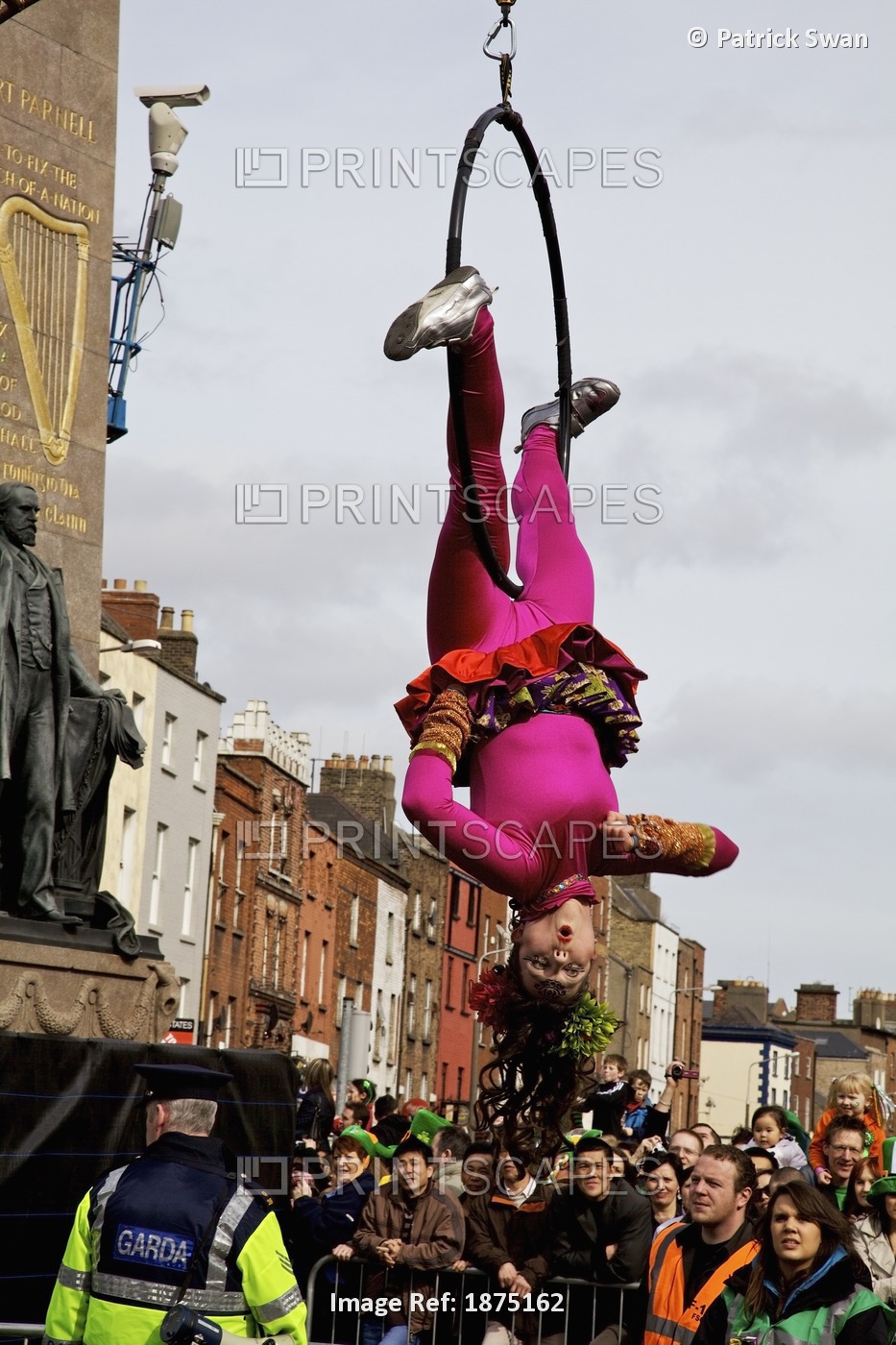 Dublin, Ireland; An Acrobat Doing A Performance In A Parade On O'connell Street