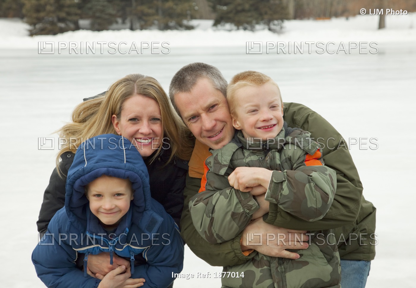 A Family Outdoors And Dressed For Winter Weather; Edmonton, Alberta, Canada