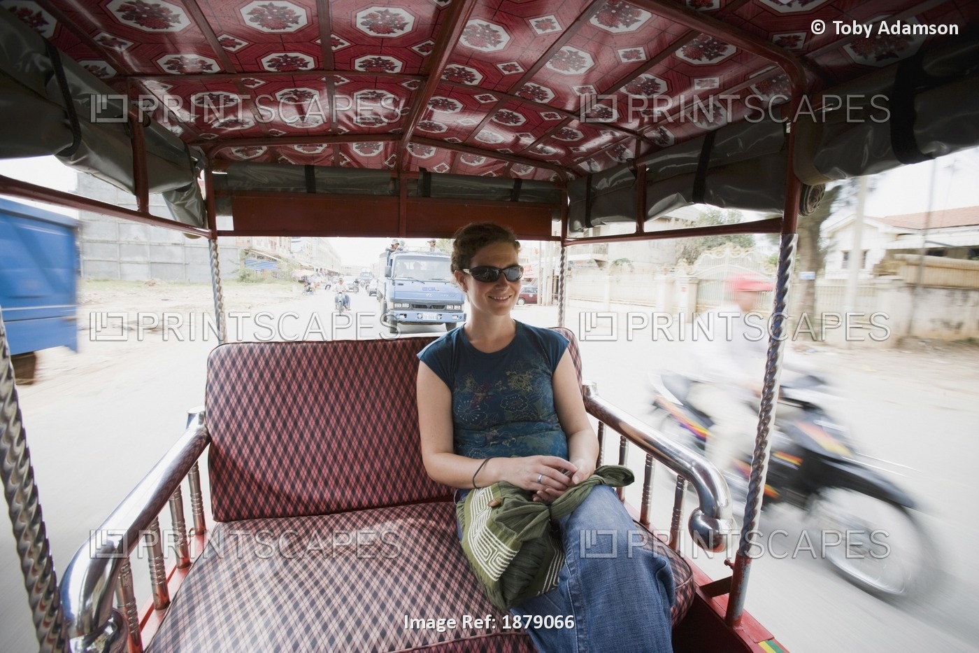 Young Woman Riding In Tuk-Tuk In Phnom Penh, Cambodia.
