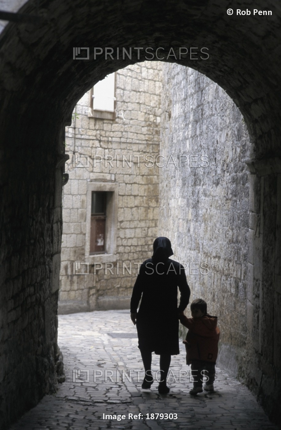 Woman With Child In Old Town Alley