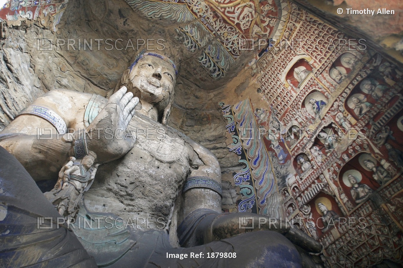 Statue And Carvings In Ancient Buddhist Temple Grotto.