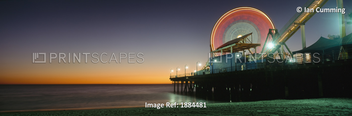 Ferris Wheel And Rollercoaster At Dusk On The Santa Monica Pier