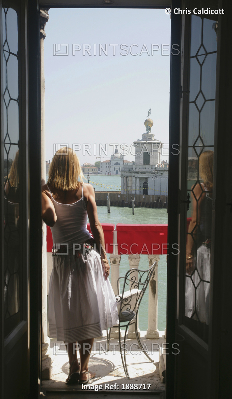 Woman Standing On Balcony Along The Grand Canal, Venice