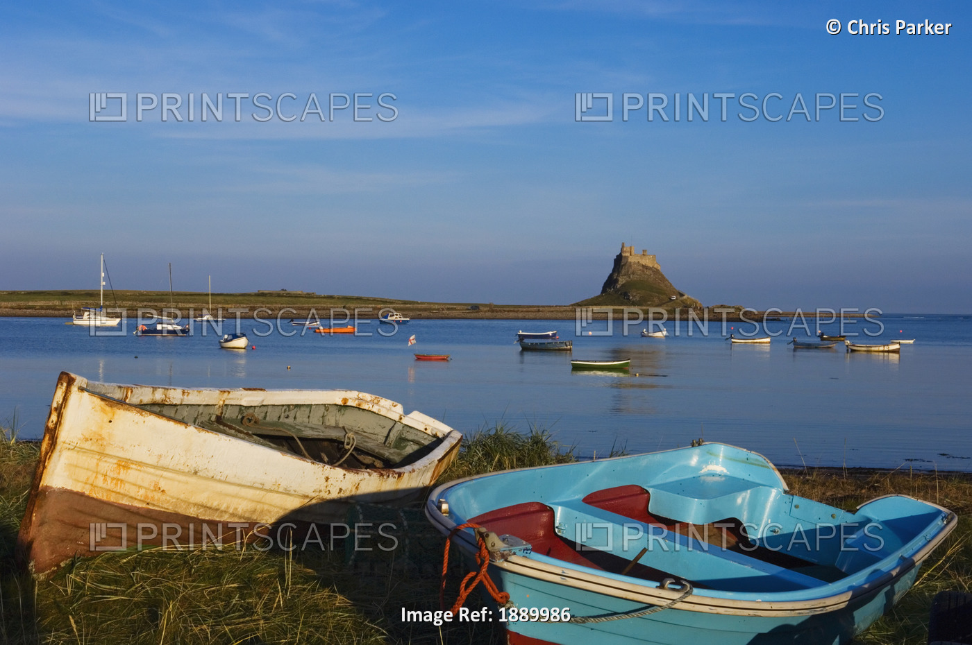 View Across Water And Boats To Lindisfarne Castle On Holy Island.