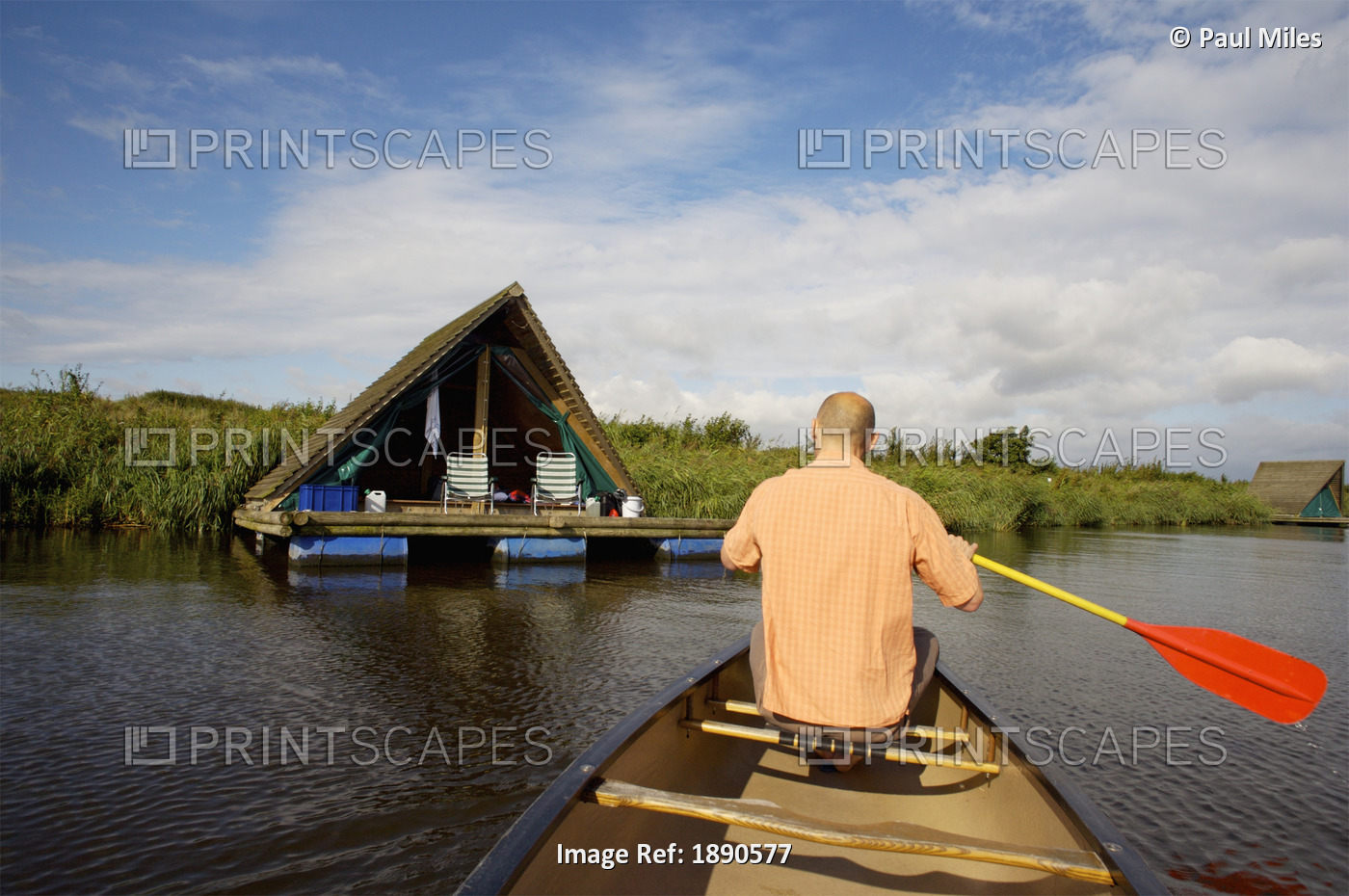 Holland, Man In Boat And Camping Raft In Background; DeHeen