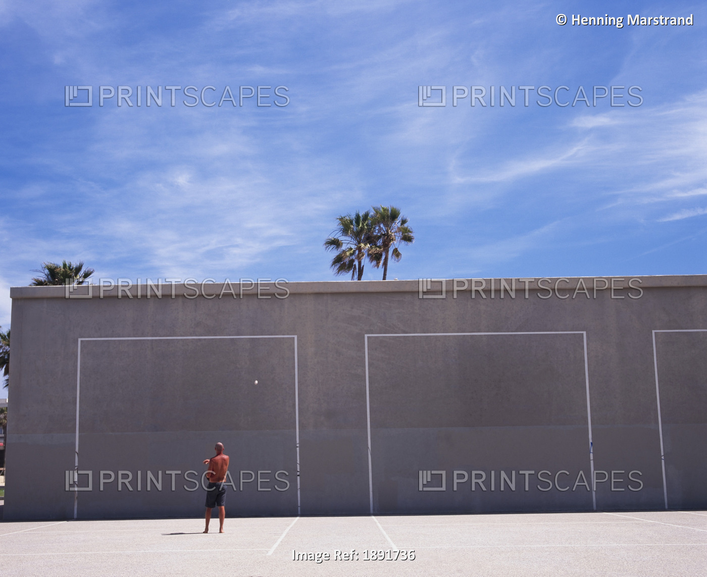 Man Playing Hand Ball At Venice Beach, Rear View