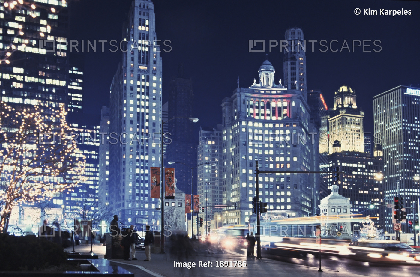 Michigan Avenue Traffic At Night With Cityscape In Background