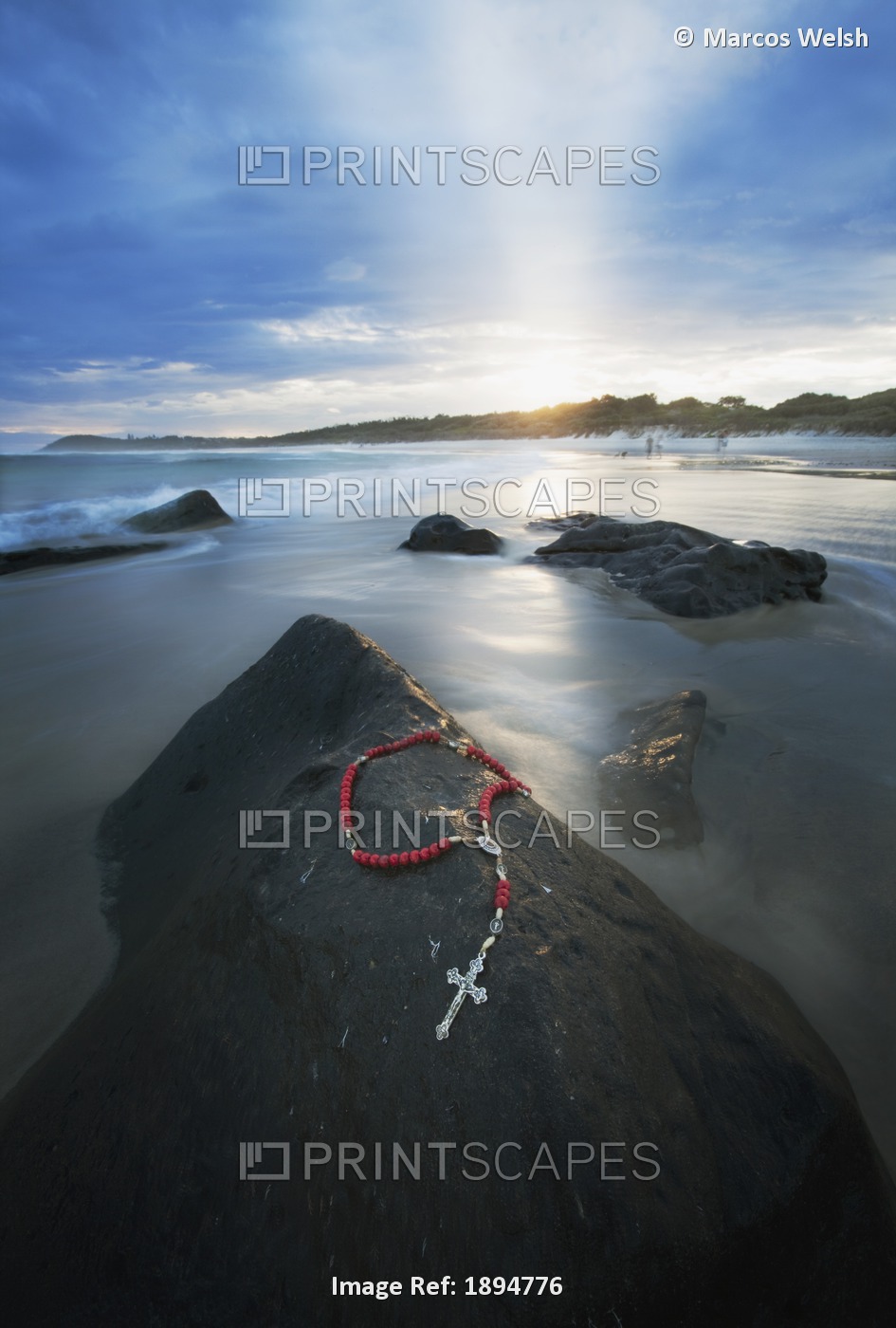 A Cross And Rosary Beads Laying On A Rock At Flat Rock; Bellina, New South ...