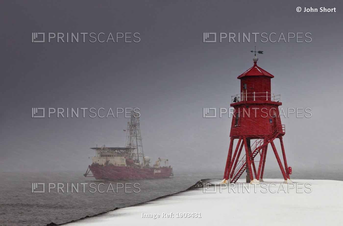 A Red Lighthouse On The Shore In Winter With A Boat Out In The Water; South ...
