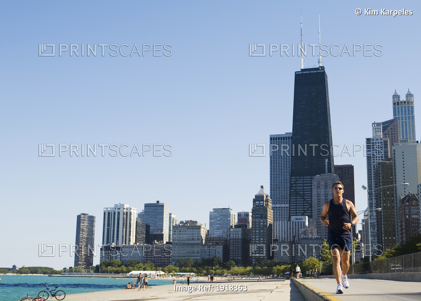 Man Jogging On Lakefront Path Along Oak Street Beach, Chicago, Illinois, Usa