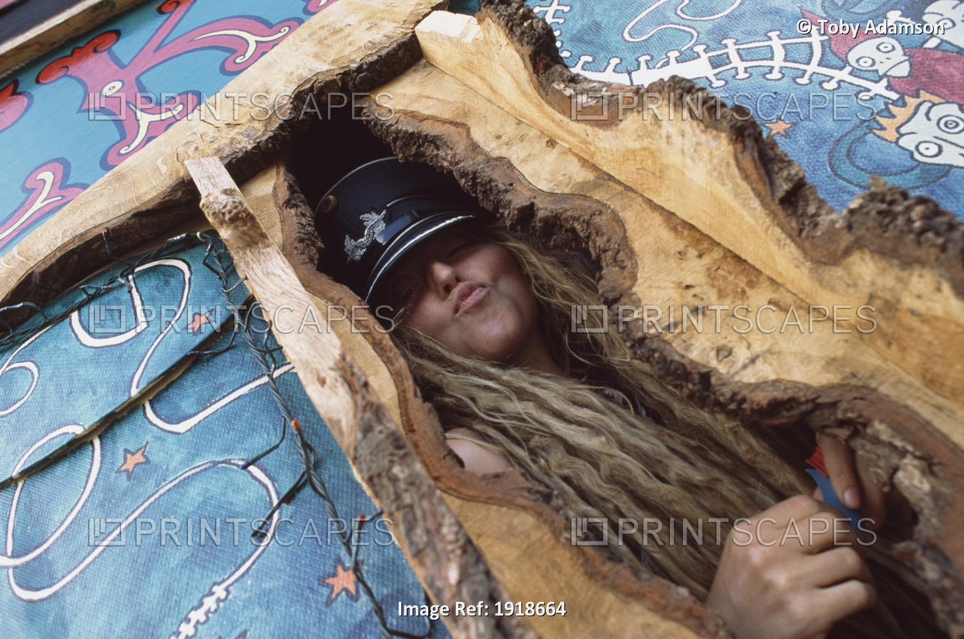 Woman Posing In Wooden Structure