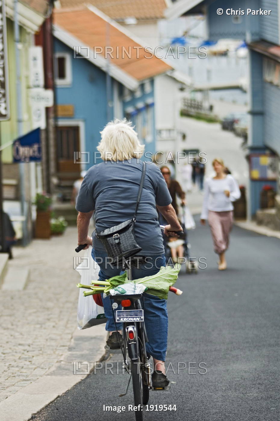 A Cyclist Travelling Through The Town Of Fjallbacka, Bohuslan, Bohuslan ...