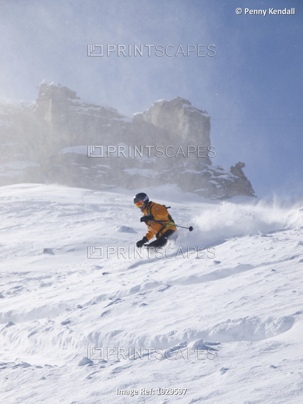 Skier wearing helmet and backpack off piste in Engelberg, Swiss Alps, ...