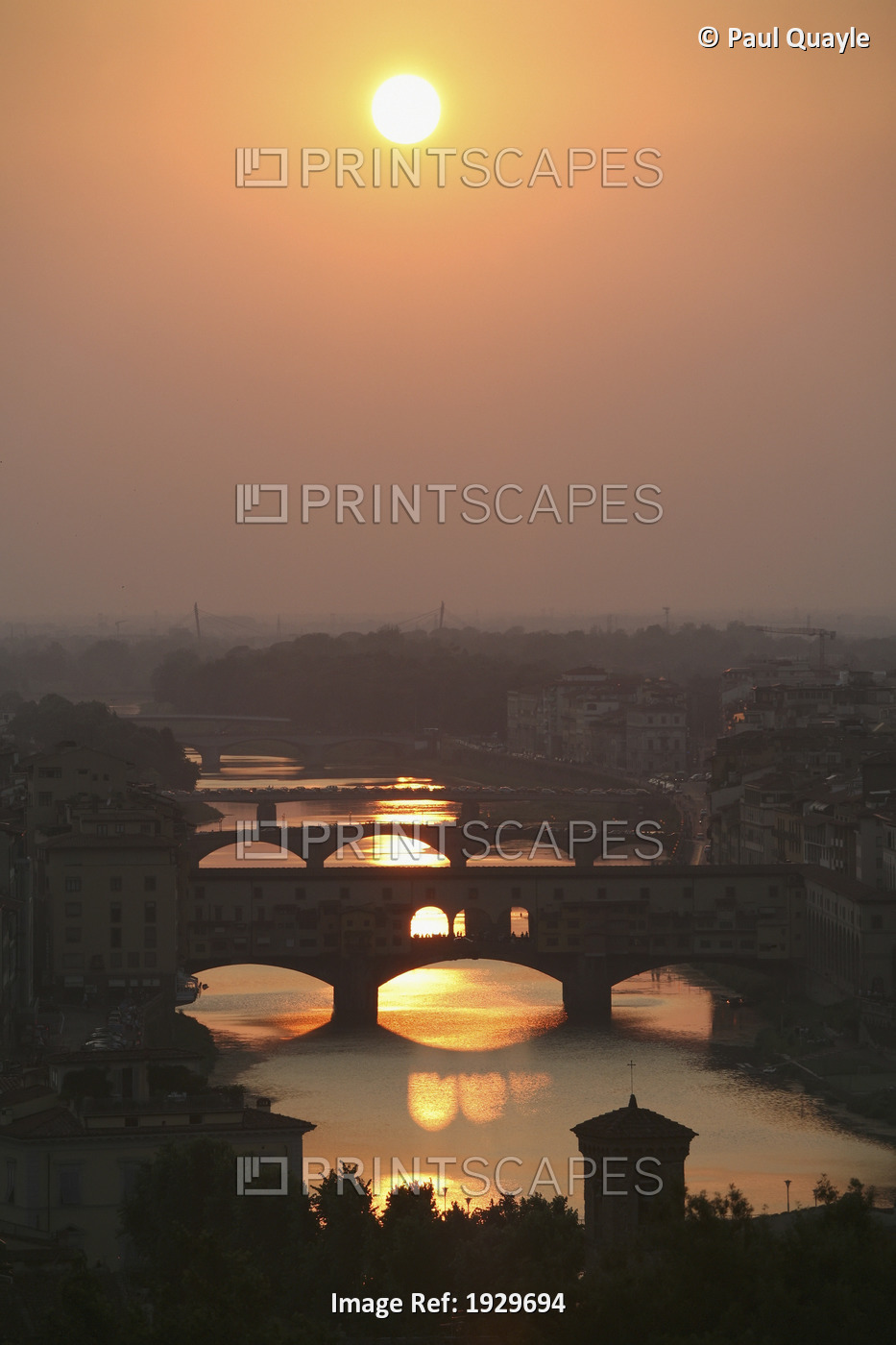 River Arno and famous bridge Ponte Vecchio, the oldest in Florence at sunset. ...