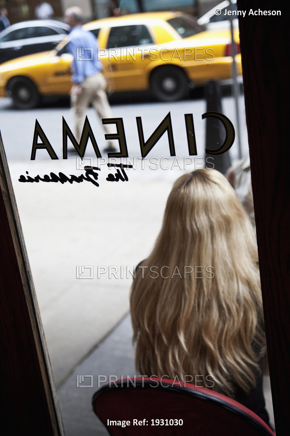 Rear View Of A Woman Sitting Outside Of Cinema Restaurant, New York City; New ...