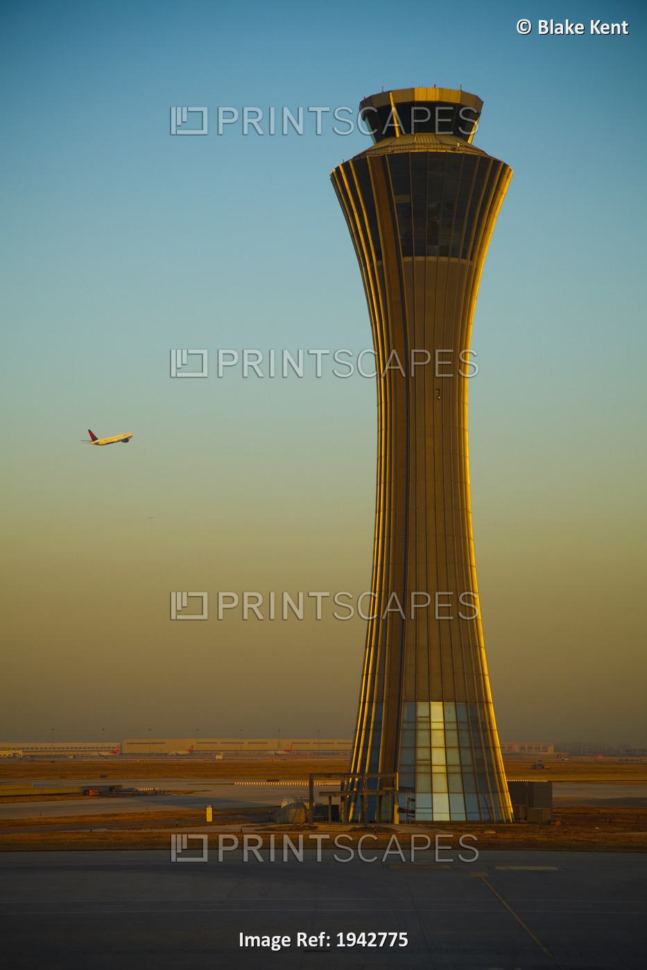 An Airplane Flies Past The Air Traffic Control Tower At The Beijing Airport; ...
